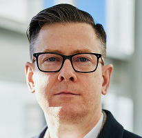 Alexander Hughes, directeur en CEO van een crypto trading bedrijf, portret